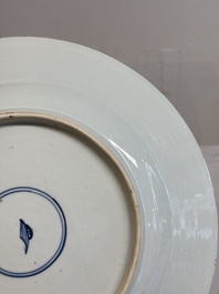 A Chinese famille verte dish with two ladies and a boy holding a lotus, artemisia leaf mark, Kangxi