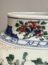 A pair of Chinese wucai vases and covers with court ladies and playing boys, Transitional period