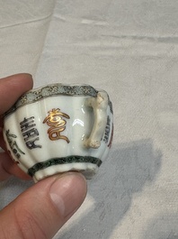 Two small Chinese famille verte handled cups with 'prunus on cracked ice' and 'shou' design, Kangxi