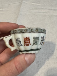 Two small Chinese famille verte handled cups with 'prunus on cracked ice' and 'shou' design, Kangxi