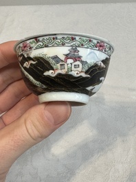 A Chinese famille rose and grisaille 'mountainous landscape' cup and saucer, Yongzheng