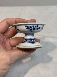 A pair of Chinese blue and white salts and a reticulated double-walled cup, Kangxi
