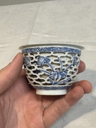 A pair of Chinese blue and white salts and a reticulated double-walled cup, Kangxi