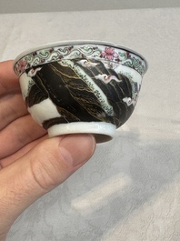A Chinese famille rose and grisaille 'mountainous landscape' cup and saucer, Yongzheng