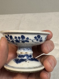 A pair of Chinese blue and white salts and a reticulated double-walled cup, Kangxi