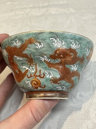 A Chinese fencai gilt-decorated 'dragons on waves' bowl and cover, Jiaqing mark, 19th C.