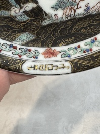 A Chinese famille rose and grisaille 'mountainous landscape' cup and saucer, Yongzheng