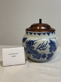 A Chinese blue and white 'qilin' jar and wooden cover, Transitional period