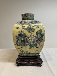 A pair of Chinese verte biscuit covered square jars on wooden stand, 19th C.