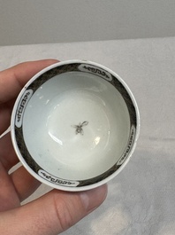 A Chinese famille rose and grisaille 'mountainous landscape' cup and saucer, Yongzheng