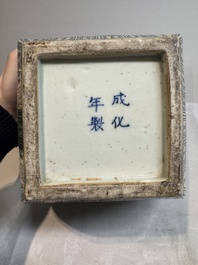 A pair of Chinese verte biscuit covered square jars on wooden stand, 19th C.
