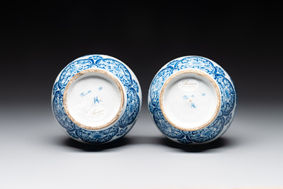 A pair of blue and white Dutch Delft double gourd vases with leopards, late 17th C.