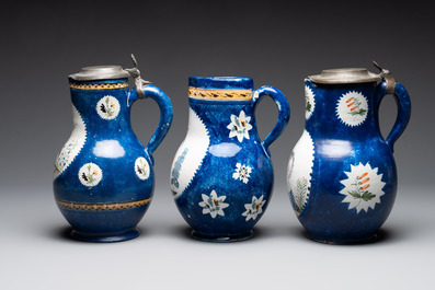 A collection of five polychrome Brussels faience jugs, some with pewter-mounts, 18/19th C.