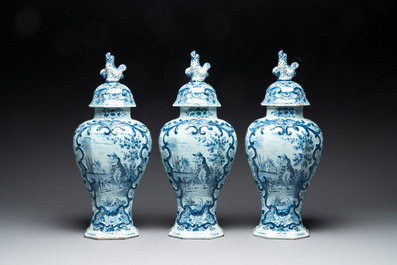 A large blue and white Dutch Delft garniture of five vases and covers, 2nd half 18th C.