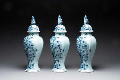 A large blue and white Dutch Delft garniture of five vases and covers, 2nd half 18th C.