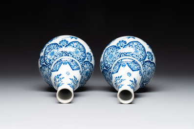 A pair of blue and white Dutch Delft double gourd vases with leopards, late 17th C.