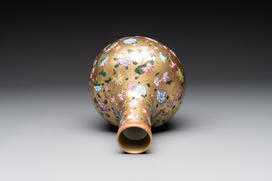 A Chinese gilt-ground famille rose vase with floral design, Qianlong mark and possibly of the period