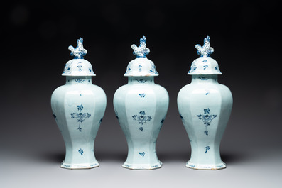 A large blue and white Dutch Delft garniture of five vases and covers, 2nd half 18th C.