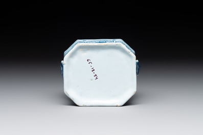 A blue and white Dutch Delft butter tub and cover with a berry finial, 18th C.