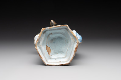 A polychrome Dutch Delft table fountain in the shape of Bacchus on a barrel, early 18th C.