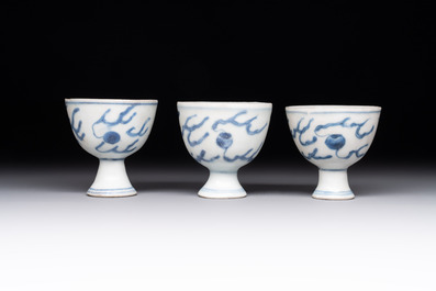 Six Chinese blue and white 'Hatcher cargo' stem cups with dragons, Transitional period