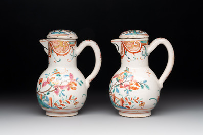 A rare polychrome Dutch Delft petit feu cruet set of two jugs and covers on a stand, 18th C.