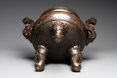 A massive Vietnamese copper- and silver-inlaid 'Buddhist lion' censer and cover on stand, 19th C.
