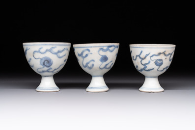 Six Chinese blue and white 'Hatcher cargo' stem cups with dragons, Transitional period