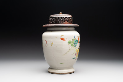 A Chinese famille rose 'warrior on horseback' vase and a wooden cover, Yongzheng/Qianlong