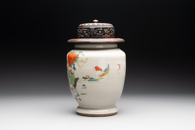 A Chinese famille rose 'warrior on horseback' vase and a wooden cover, Yongzheng/Qianlong