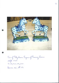 A pair of blue and white Dutch Delft prancing horses on a green-glazed base, 18th C.