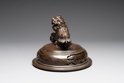 A massive Vietnamese copper- and silver-inlaid 'Buddhist lion' censer and cover on stand, 19th C.