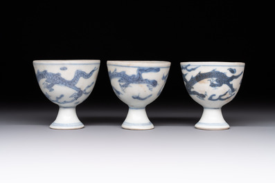 Six Chinese blue and white 'Hatcher cargo' stem cups with dragons, Transitional period