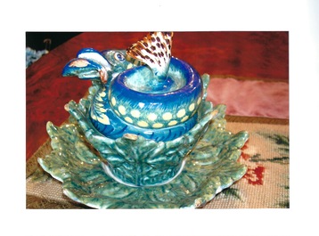A rare polychrome Dutch Delft pike tureen and cover on stand, 18th C.