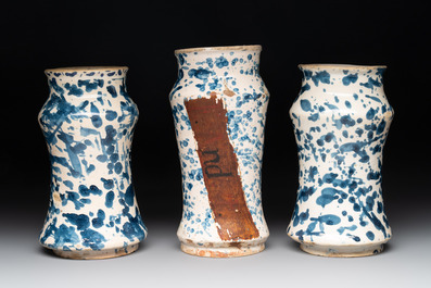 Three blue and white splash-glazed albarelli, Spain, 17th C.