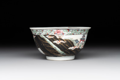 A Chinese famille rose and grisaille 'mountainous landscape' cup and saucer, Yongzheng