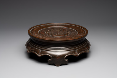 A massive Vietnamese copper- and silver-inlaid 'Buddhist lion' censer and cover on stand, 19th C.