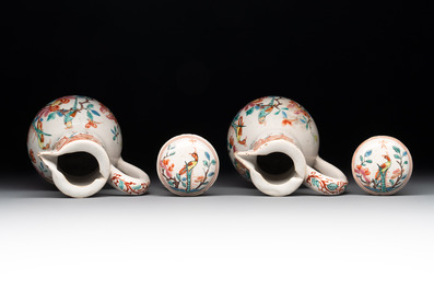 A rare polychrome Dutch Delft petit feu cruet set of two jugs and covers on a stand, 18th C.