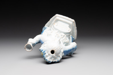 A polychrome Dutch Delft table fountain in the shape of Bacchus on a barrel, early 18th C.