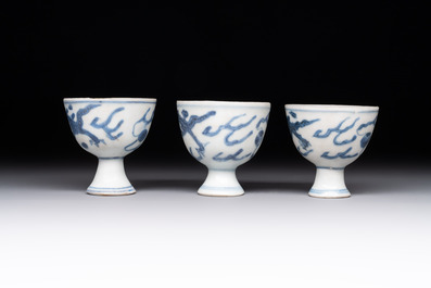 Six Chinese blue and white 'Hatcher cargo' stem cups with dragons, Transitional period
