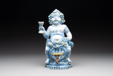 A polychrome Dutch Delft table fountain in the shape of Bacchus on a barrel, early 18th C.