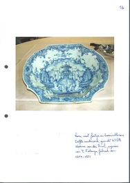 A blue and white Dutch Delft basin with putti near a fountain, 18th C.