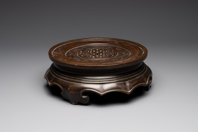 A massive Vietnamese copper- and silver-inlaid 'Buddhist lion' censer and cover on stand, 19th C.