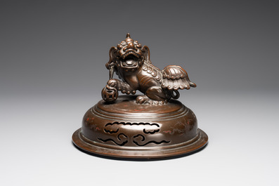 A massive Vietnamese copper- and silver-inlaid 'Buddhist lion' censer and cover on stand, 19th C.