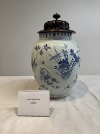 A Chinese blue and white vase with floral design and wooden cover, Transitional period