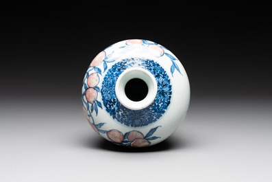A Chinese blue, white and copper-red 'meiping' vase with 17 peaches, Yongzheng mark, 19/20th C.