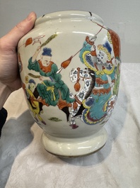 A Chinese famille rose 'warrior on horseback' vase and a wooden cover, Yongzheng/Qianlong