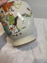 A Chinese famille rose 'warrior on horseback' vase and a wooden cover, Yongzheng/Qianlong
