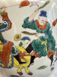A Chinese famille rose 'warrior on horseback' vase and a wooden cover, Yongzheng/Qianlong