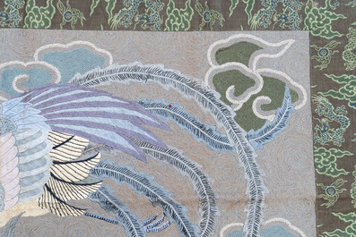 A Japanese embroidered wool and silk wall tapestry with two phoenixes, Meiji, 19th C.